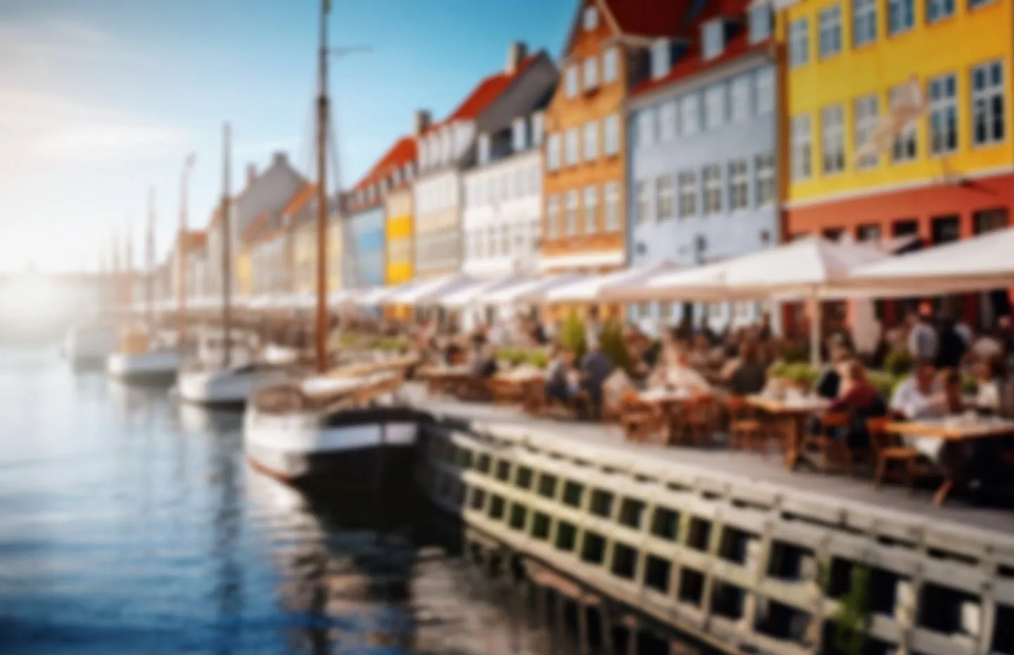 Colorful canal houses and boats along Nyhavn in Copenhagen